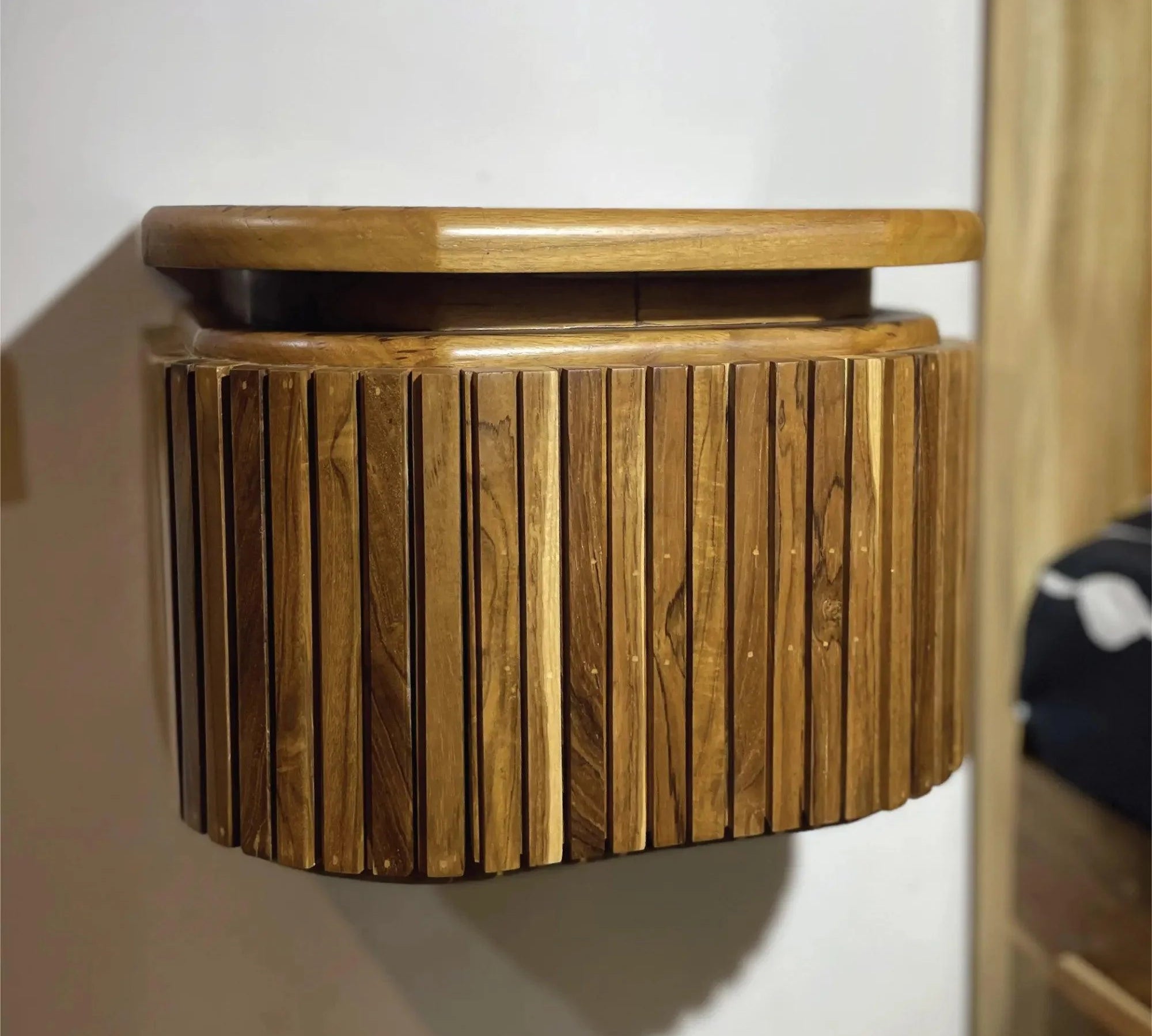 Wood Ceylon modern floating nightstand with drawer made of natural wood slats mounted on wall
