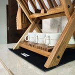 Wood Ceylon small dish drying rack with wooden frame holding white cups on kitchen counter