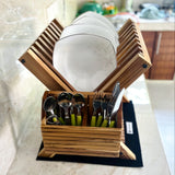 Wood Ceylon small dish drying rack with white plates and green-handled cutlery on kitchen counter