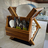 Wood Ceylon wooden dish drying rack holding plates, bowls, and utensils on kitchen counter